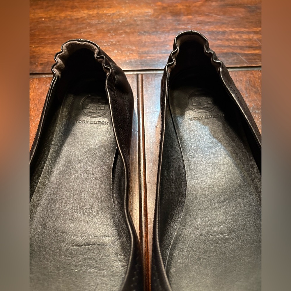 Tory Burch Black Flats with Gold Emblem - Picture 5 of 9
